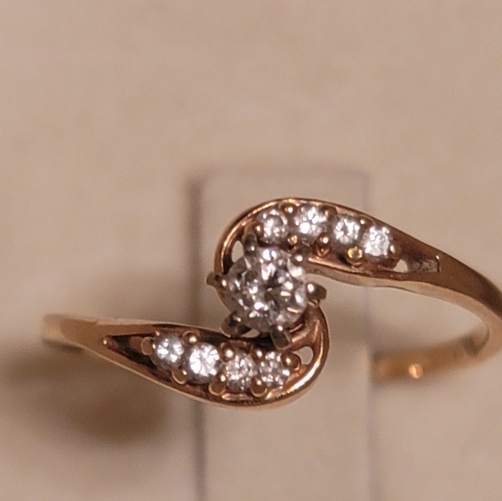 Used 14k solid yellow/white gold and natural diamonds ring size 9.
